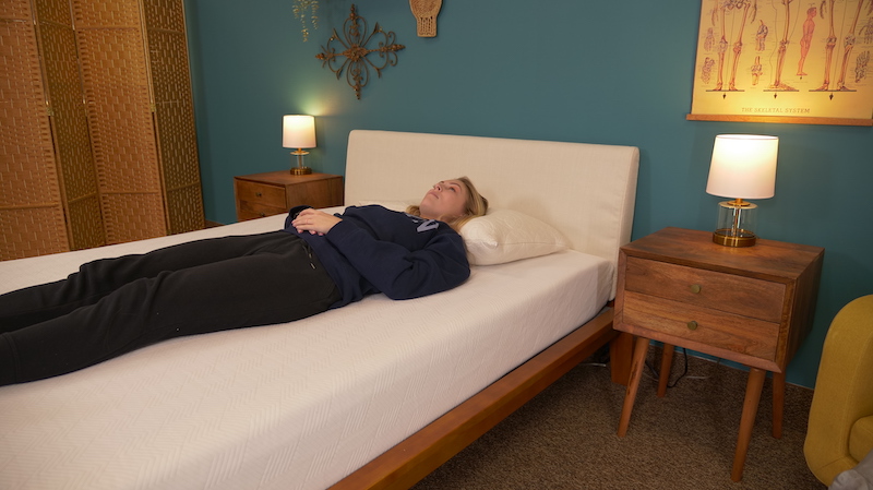 Best Full-Size Mattresses 32 Julia Forbes testing a mattress for back sleeping