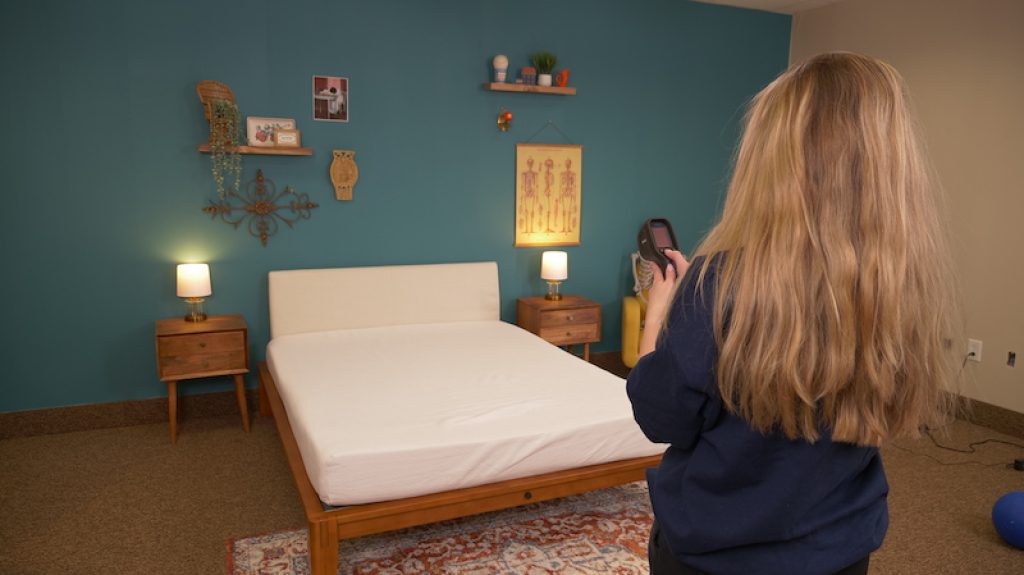 Best Mattress for Kids - Expert Reviewed 123 Julia Forbes testing temperature dissipation on a mattress