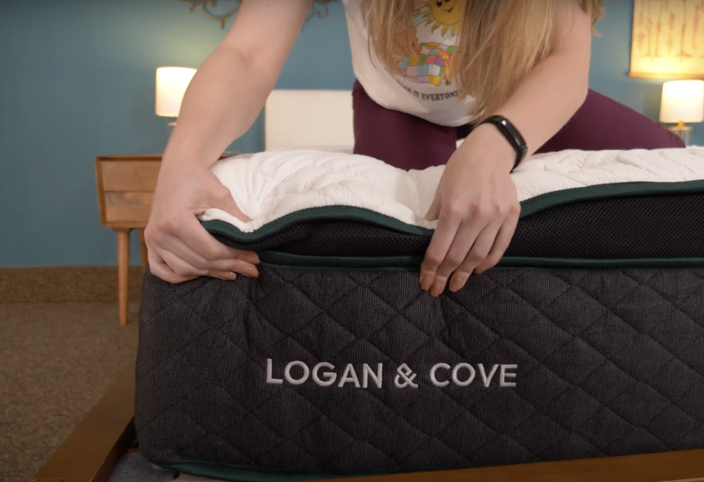 My In-Depth Logan & Cove Frontier Hybrid Mattress Review 2025 9 Lead Product tester Julia Forbes, testing edge support on the Logan & Cover Frontier